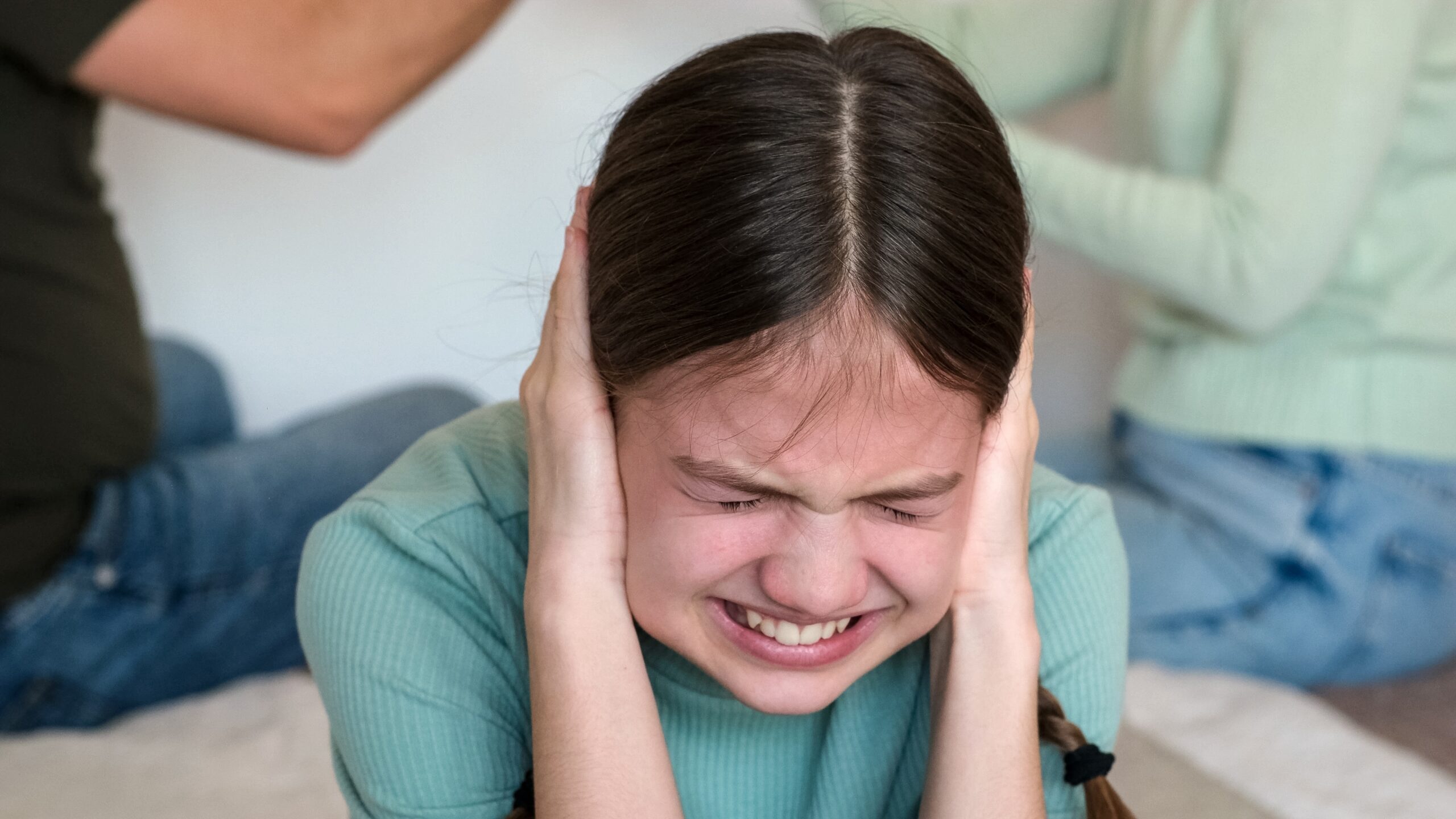 Kid,Girl,Crying,And,Covering,Her,Ears,With,Hands,While